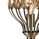 Close-up of the Marisa 1 Light Crystal Table Lamp in antique brass, featuring faceted amber crystal accents that evoke the elegance of a Middle Eastern lantern lamp.