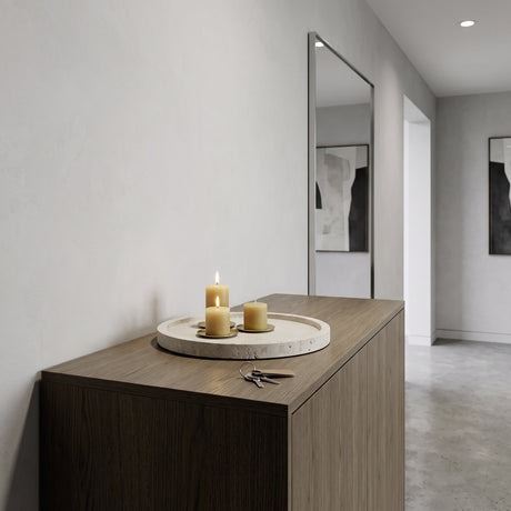 Maromandia Stone Tray 30cm in beige holds three lit candles on a wooden sideboard, styled in a hallway with keys and a tall wall mirror.
