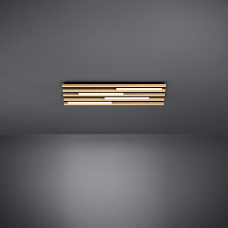 Marreira LED Panel Light in black steel, a long low ceiling fixture with staggered wood slats and offset LED bars, shown against a plain grey background.