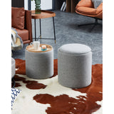 Mashike Stool Set of 2 in grey woven fabric with lift-off lids, one shown as a wood veneer tray table, styled in a living room beside a sofa and armchair.