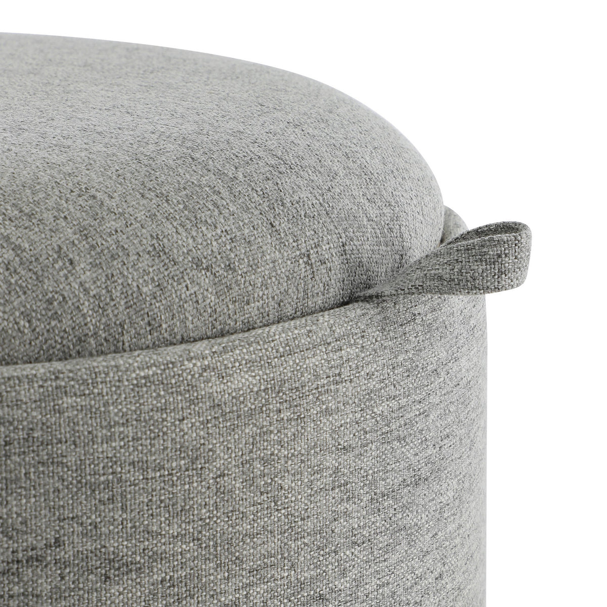 Close-up of the Mashike Stool's grey woven fabric upholstery and padded lid, showing a fabric pull handle and the round drum body.