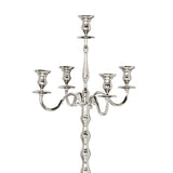 Maxaas Candlestick in polished nickel aluminium, close-up of the five-arm candelabra top with scrolled branches and a ridged central column on a white background.
