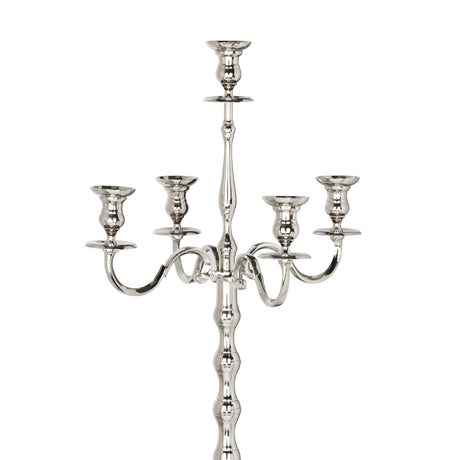 Maxaas Candlestick in polished nickel aluminium, close-up of the five-arm candelabra top with scrolled branches and a ridged central column on a white background.