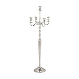 Maxaas Candlestick in Nickel, a tall aluminium floor candelabra with a stepped round base, ringed central column, and five scrolling arms, shown on a plain white background.