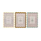 Set of 3 rectangular photo frames with wavy edges in cream, ochre and sage green, each with a patterned mat holding a 5 x 7in photo, shown on a white background.
