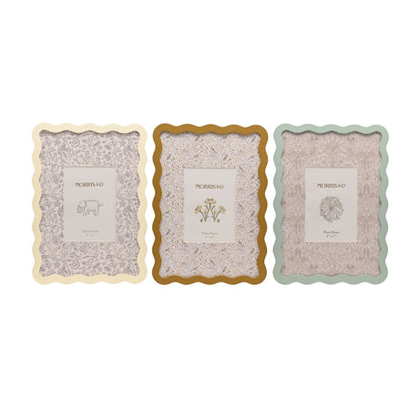 Set of 3 rectangular photo frames with wavy edges in cream, ochre and sage green, each with a patterned mat holding a 5 x 7in photo, shown on a white background.