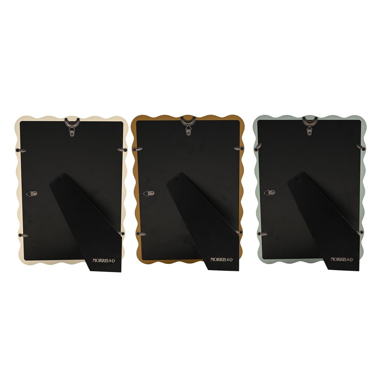 Rear view of three Baby Wiggle photo frames in cream, ochre and blue with wavy edges, showing black backing boards and fold-out stands on a white background.