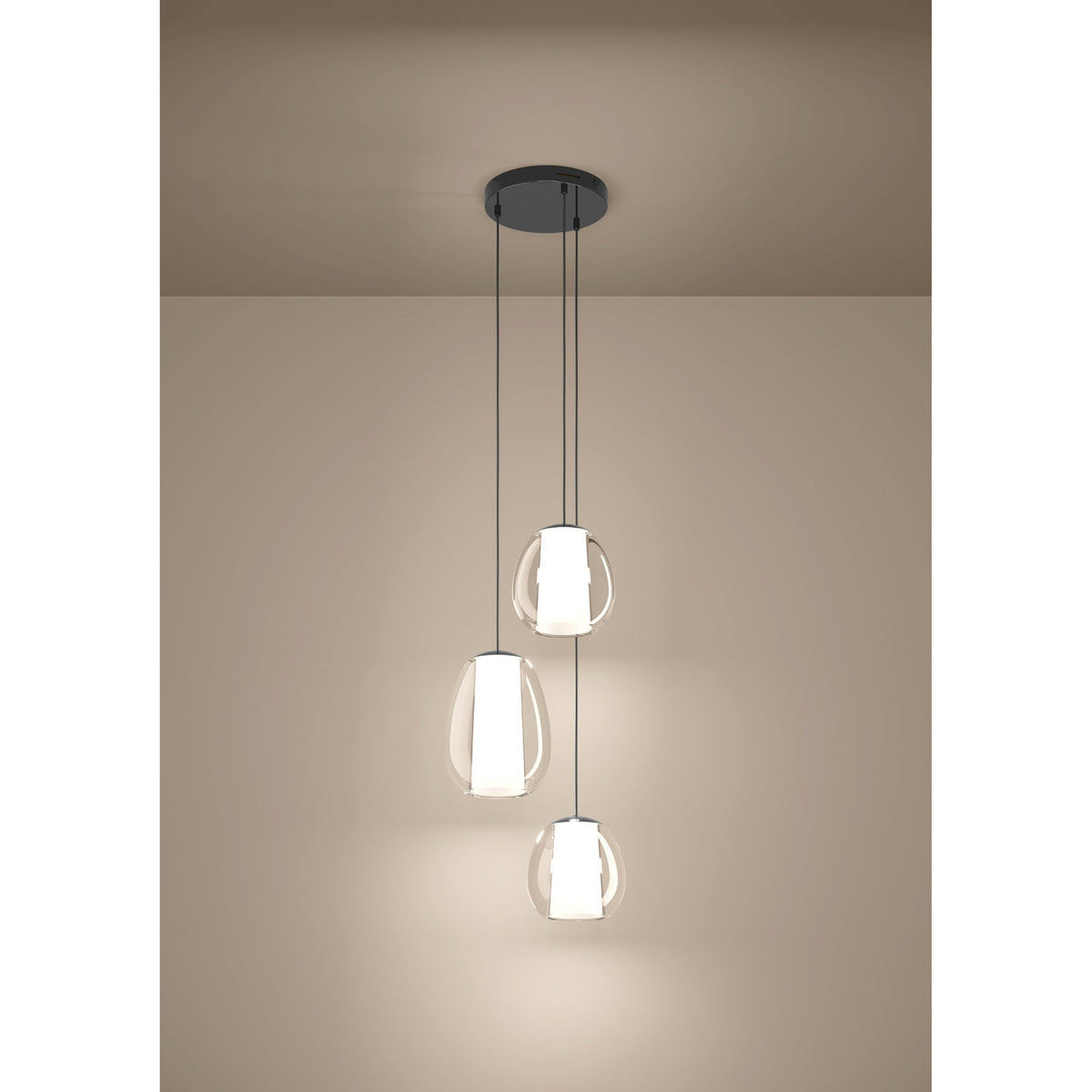 Menorca Glass 3 Light Pendant in black nickel, three staggered egg-shaped clear glass shades with white satin diffusers, shown illuminated against a neutral wall.