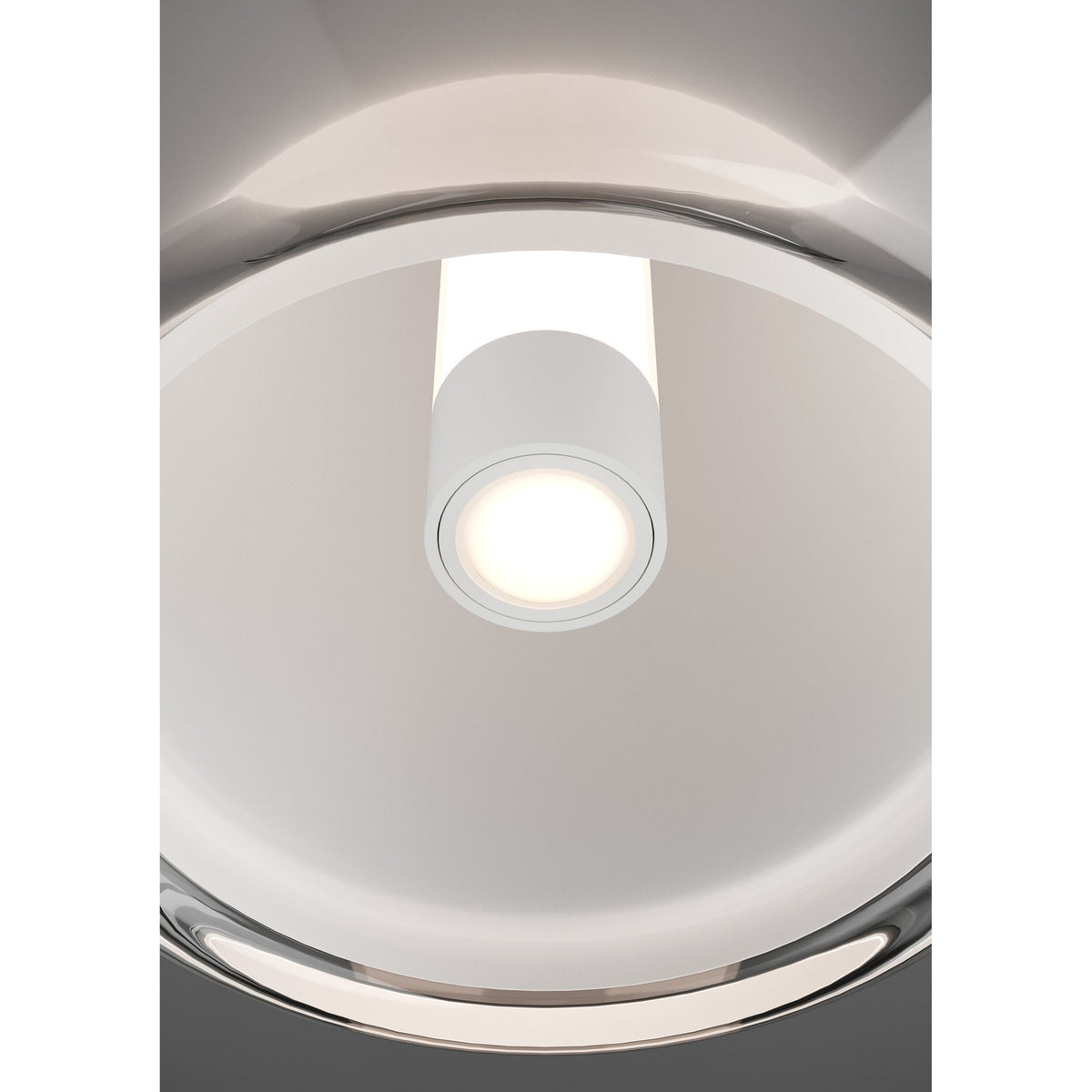 Close-up ceiling view of the Menorca pendant light's white cylindrical LED diffuser glowing within a black nickel circular canopy.