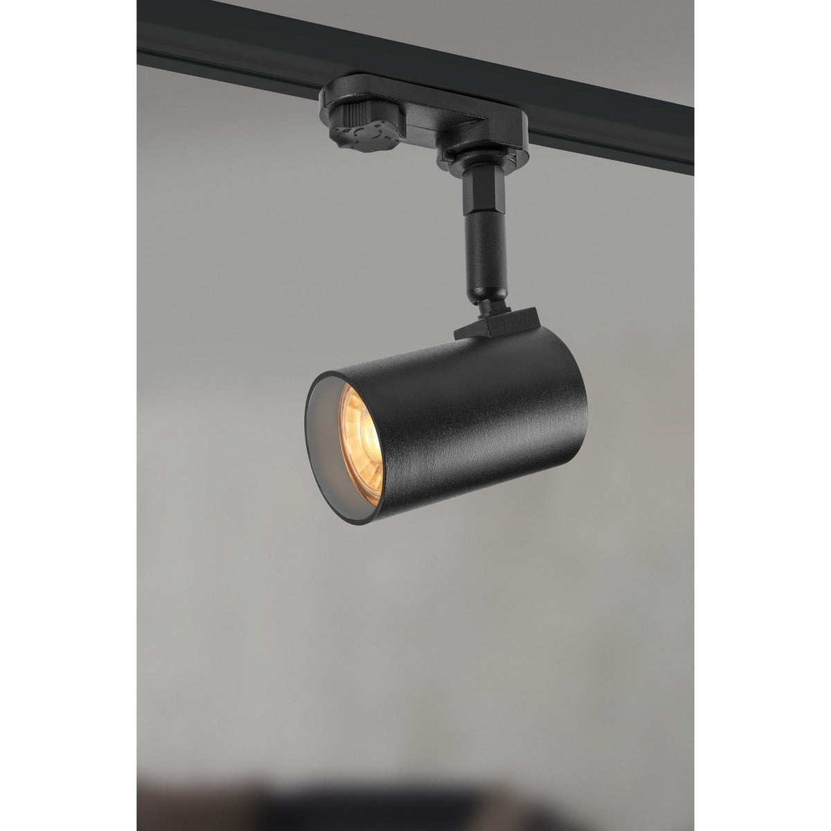 Merea Track Spotlight in black, cast aluminium cylindrical head on an adjustable stem with track adapter, mounted on a black track against a plain grey background.