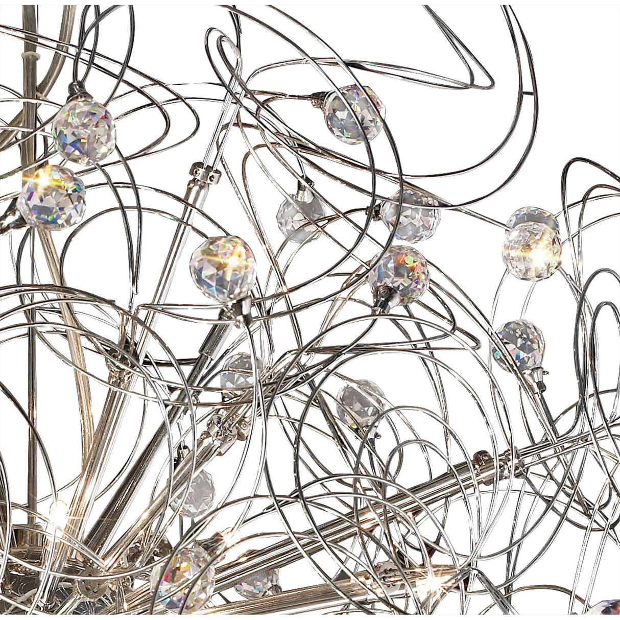 Close-up of Diyas Messe 24 light crystal semi-flush ceiling light, showing polished chrome wire curves and faceted crystal spheres against a white background.