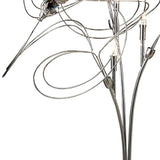 A close-up of the Messe 3 Light Crystal Table Lamp in polished chrome, showcasing curved metal arms, exposed bulbs, and a decorative Asfour crystal element near the top.