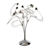 The Messe 3 Light Crystal Table Lamp features a polished chrome base with curved metal arms, each ending in a decorative glass sphere, creating an abstract swirling look ideal for contemporary spaces.