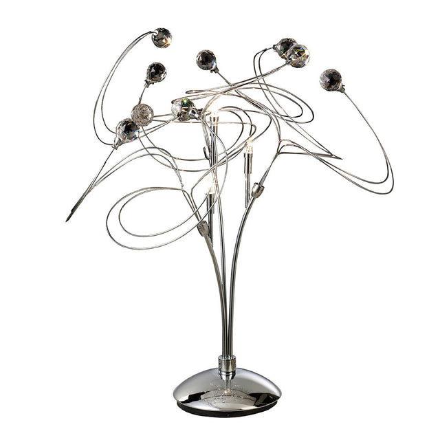The Messe 3 Light Crystal Table Lamp features a polished chrome base with curved metal arms, each ending in a decorative glass sphere, creating an abstract swirling look ideal for contemporary spaces.