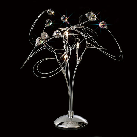 The Messe 3 Light Crystal Table Lamp in polished chrome features curved metal arms, small lights, and Asfour crystal spheres for a striking starburst effect against a black background.