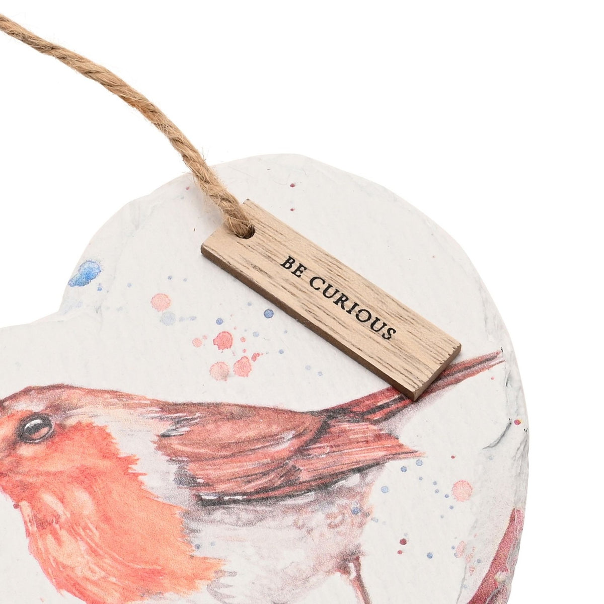 Heart-shaped slate plaque, 15cm, with watercolour robin on a branch, pink and blue paint splashes, jute hanging cord and a wooden "Be Curious" tag.