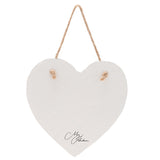 Heart-shaped slate plaque with a white painted surface and natural uneven edge, hung by a jute cord through two corner holes, signed in black script, shown on a plain white background.