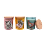 Set of 3 mini round scented candles with wooden lids, in pink with donkeys, amber with a bumblebee and blossom, and teal with a pheasant design, on a white background.