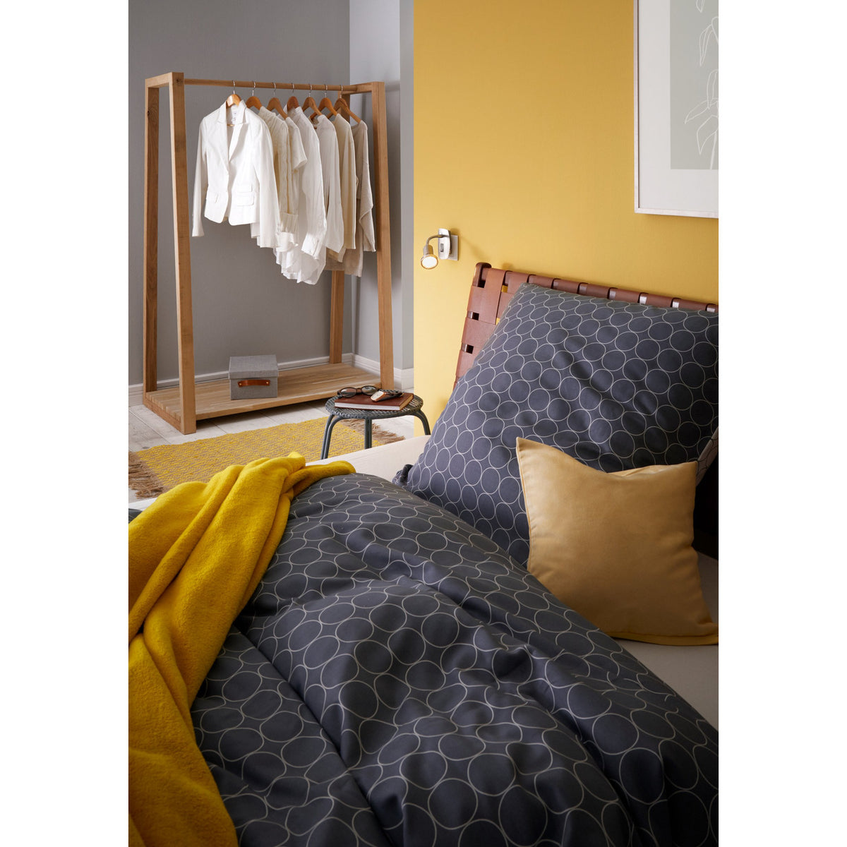 Mini 4 plug-in spotlight with satin nickel backplate, rocker switch, chrome gooseneck arm and satin nickel spot head with chrome rim for a GU10 bulb, shown on a bedroom wall.