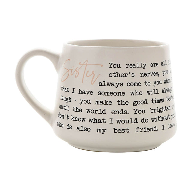 White stoneware mug with curved handle, featuring "Sister" in rose gold script and a black typewriter-style message wrapping around the cup, shown on a plain white background.