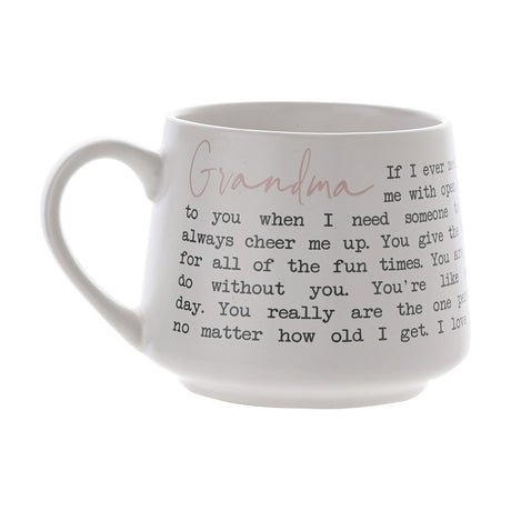 White tapered stoneware mug with matt finish, featuring "Grandma" in pink script and a black typewriter-style verse wrapped around the body, shown on a plain background.