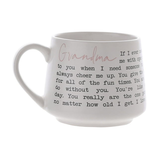 White tapered stoneware mug with matt finish, featuring "Grandma" in pink script and a black typewriter-style verse wrapped around the body, shown on a plain background.