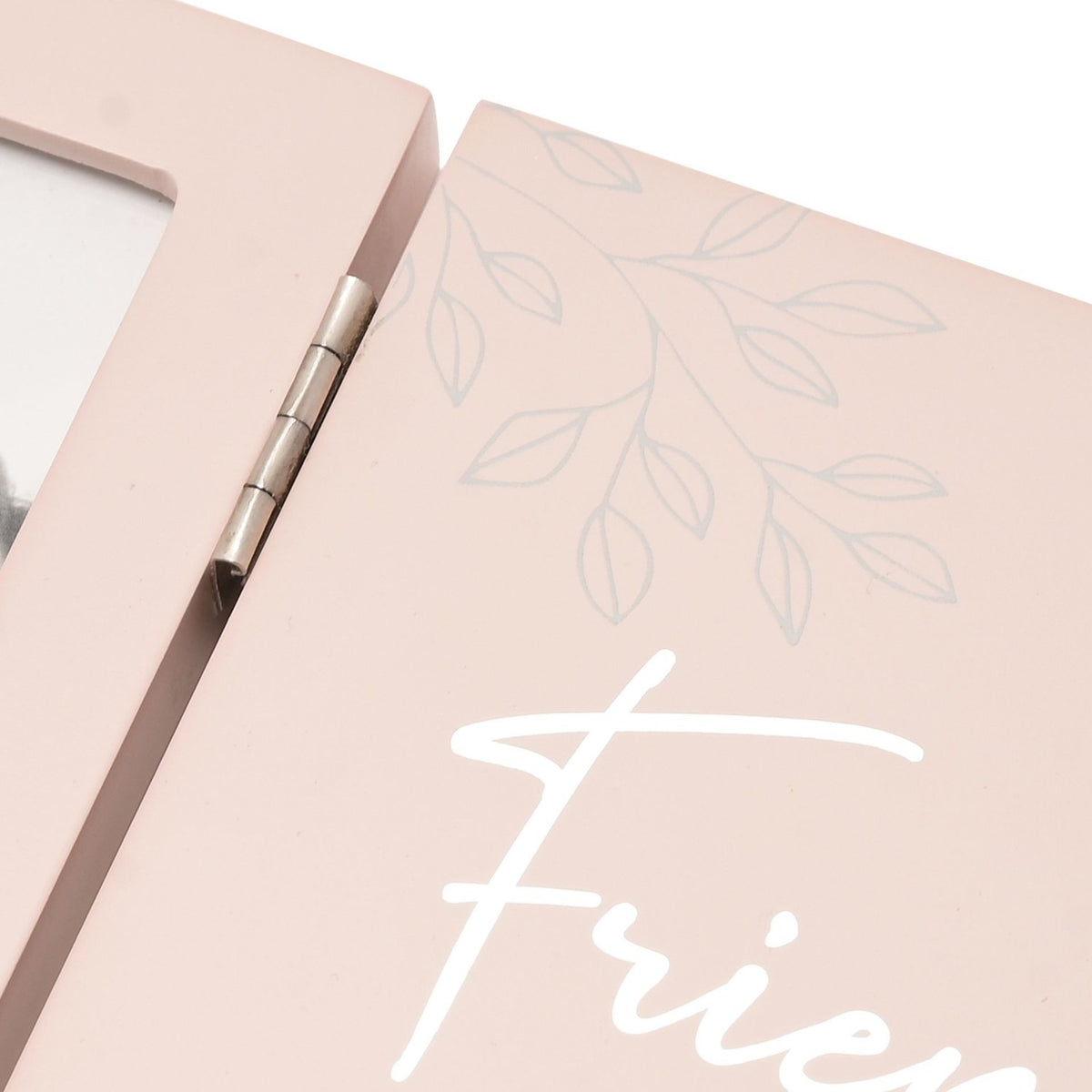 Close-up of the Friends Verse Hinged Matt Wooden Photo Frame in pink, showing the metal hinge, photo aperture edge, and script text with a leaf motif.