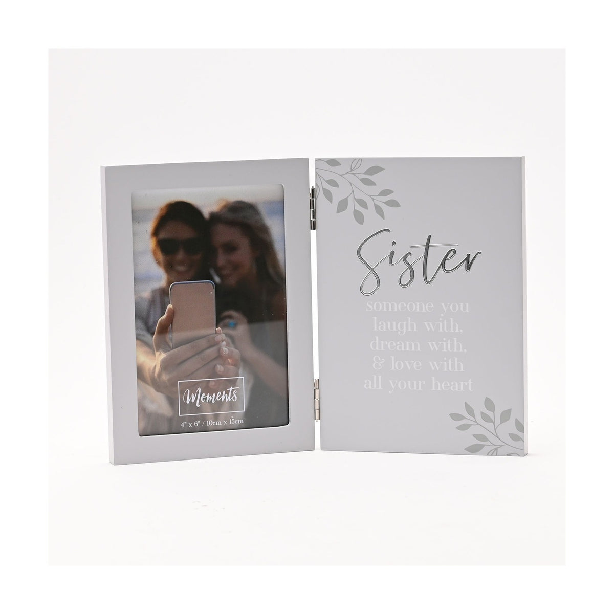 Hinged grey photo frame with a 6 x 4in portrait window on the left and "Sister" verse in silver script and white lettering on the right, shown on a white background.