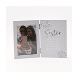 Hinged grey photo frame with a 6 x 4in portrait window on the left and "Sister" verse in silver script and white lettering on the right, shown on a white background.