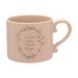 Brown stoneware mug with curled loop handle, featuring a line-drawn floral wreath and "A lucky few have a MUM like you" text, shown on a plain white background.