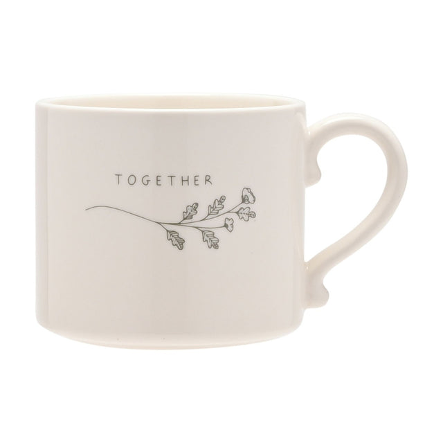 White glazed stoneware mug with curled handle, printed "TOGETHER" text and a grey floral sprig design, shown on a plain white background.
