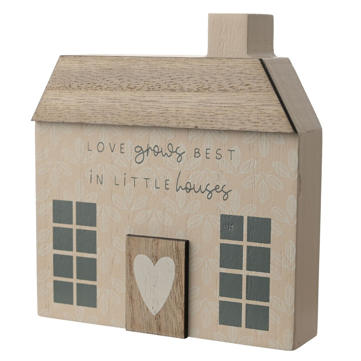 Beige wooden cottage-shaped wall art with a pitched roof, chimney, paned windows, a raised door with a white heart, and the text Love Grows Best in Little Houses.