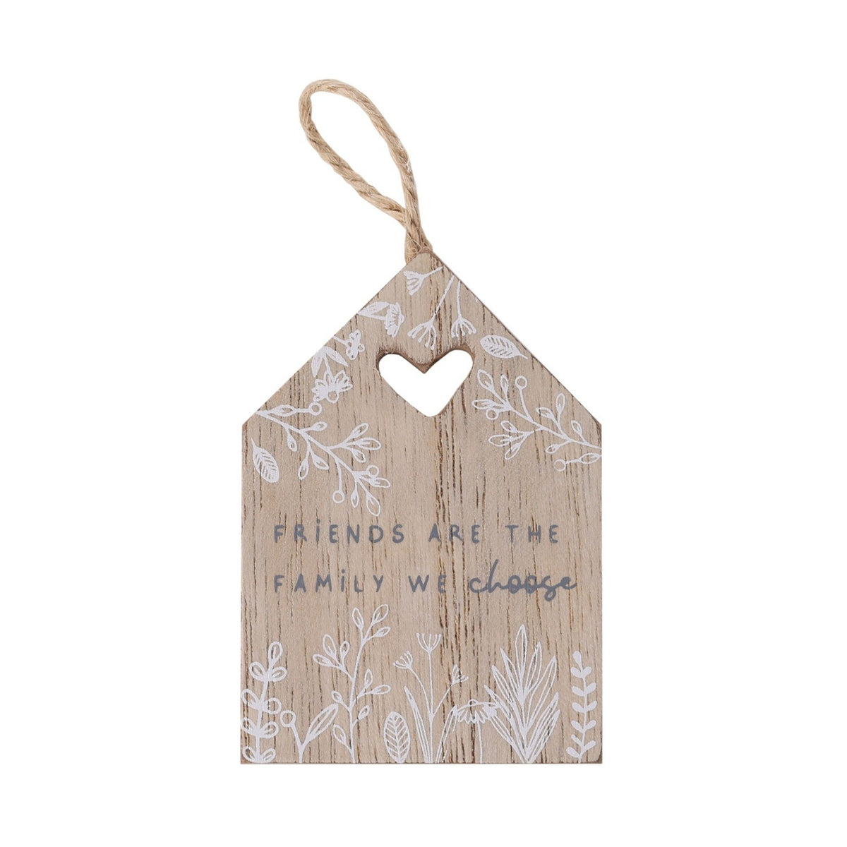 Natural wood mini house-shaped plaque with a cut-out heart, jute hanging loop, white floral print, and grey text reading "Friends are the family we choose," on a plain white background.