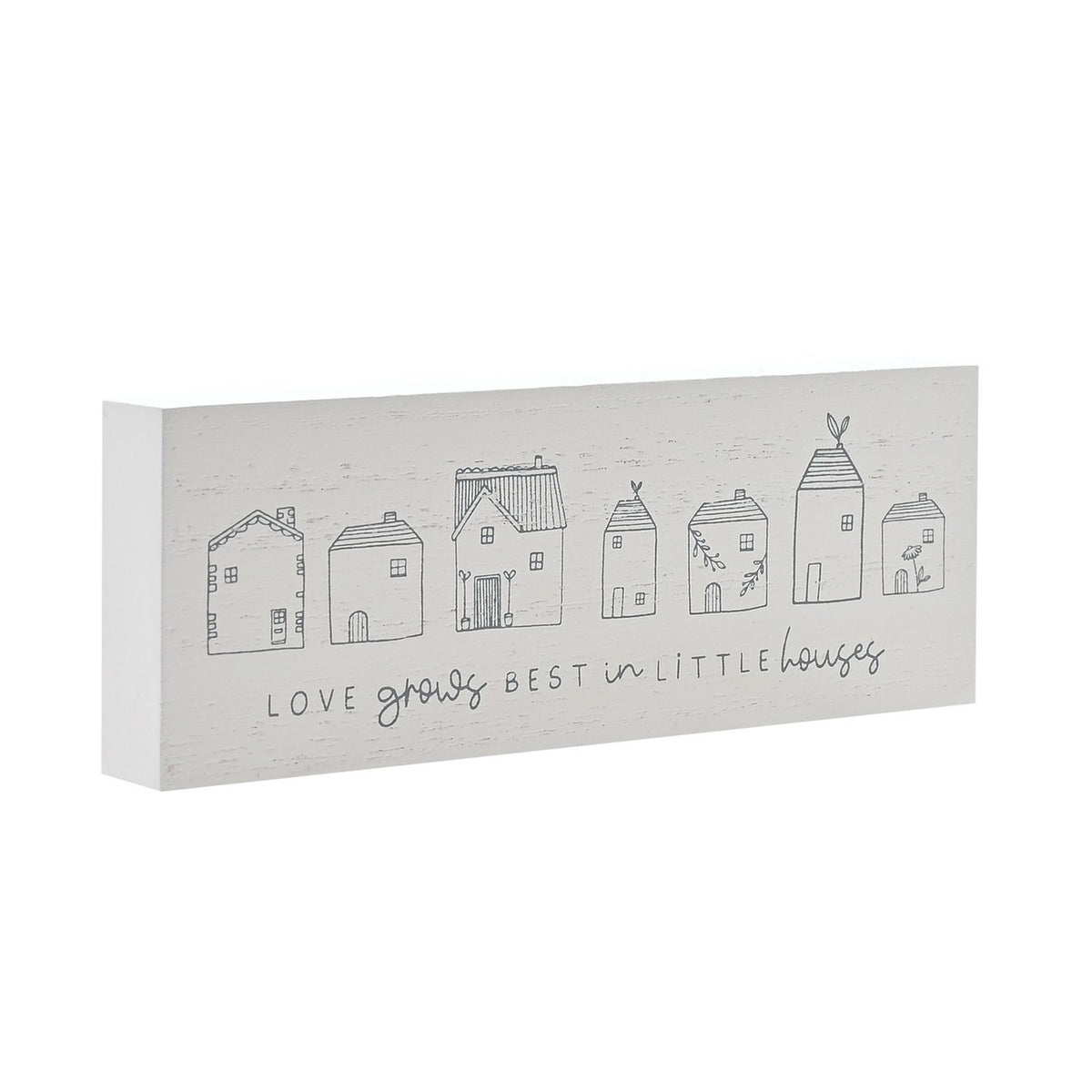 White wooden mantel plaque with a row of seven line-drawn houses and "LOVE grows BEST in LITTLE houses" text in grey, shown at an angle on a plain background.