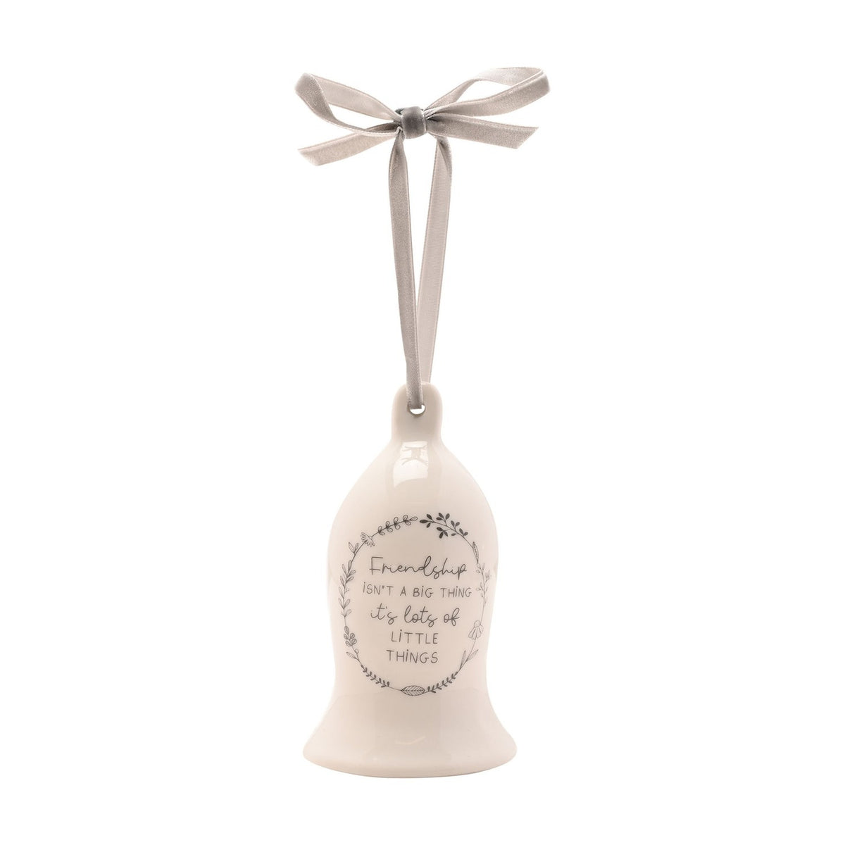 White ceramic bell ornament with a grey "Friendship isn't a big thing, it's lots of little things" wreath design, hung from a grey ribbon bow on a plain background.