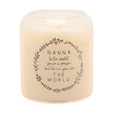 Round cream scented candle in a glass jar, printed with a grey leafy wreath and "Nanna to the world... THE WORLD" sentiment, on a plain white background.