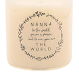 Close-up of a cream round scented candle with a grey leafy wreath design, printed with "NANNA to the world you're a person, but to me, you are THE WORLD".