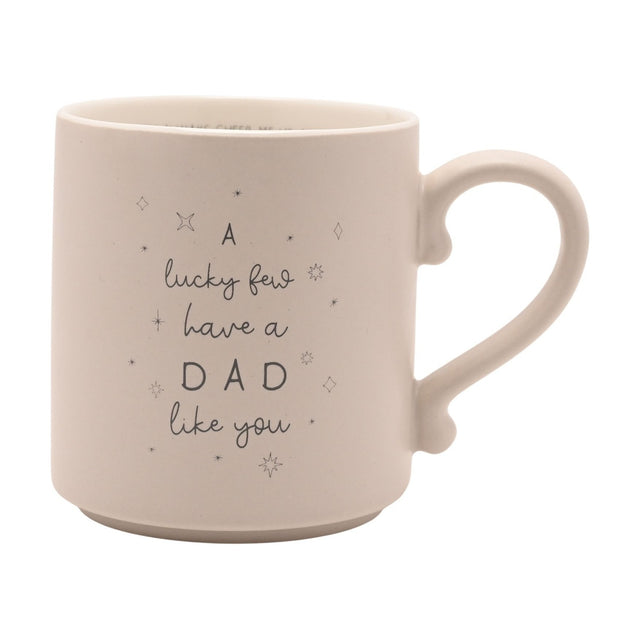 Cream ceramic mug with curved handle, printed with "A lucky few have a DAD like you" in looping script and star accents, plus hidden text inside the rim, set against a plain white background.