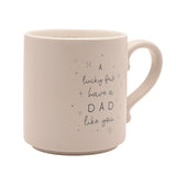 Cream ceramic mug with curved handle, featuring "A lucky few have a DAD like you" in looping script with star accents, set against a plain white background.