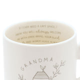 Close-up of the cream Grandma Best Friend Mug 400ml, showing handwritten-style text inside the rim and a line-drawn house with sprigs and "GRANDMA" on the outer surface.