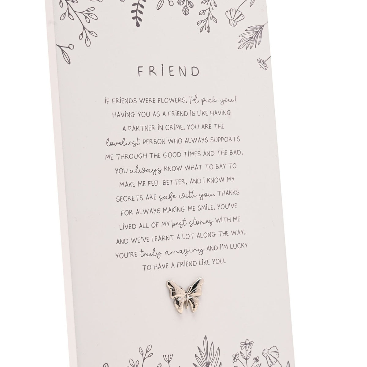 Off white rectangular standing plaque with "Friend" verse in grey text, hand-drawn floral sprigs, and a small silver-tone butterfly accent at the base.