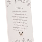 Off white rectangular standing plaque with "Friend" verse in grey text, hand-drawn floral sprigs, and a small silver-tone butterfly accent at the base.