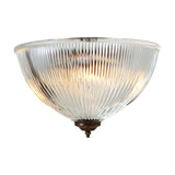 Moroni Twin Ribbed Glass Flush Ceiling Light with a domed ribbed glass shade, brass finial base, and illuminated bulbs visible within, shown on a plain white background.