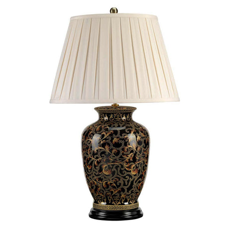 The Morris 1 Light Large Table Lamp - Gold & Black features a black base beautifully adorned with gold floral patterns, reminiscent of exquisite Chinese porcelain. It is elegantly finished with a pleated white lampshade that sits gracefully atop its round base.