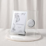 Glass photo frame with mirrored silver border for a 6 x 4in photo, featuring a round silver 30th Birthday badge, displayed upright on a marble base.