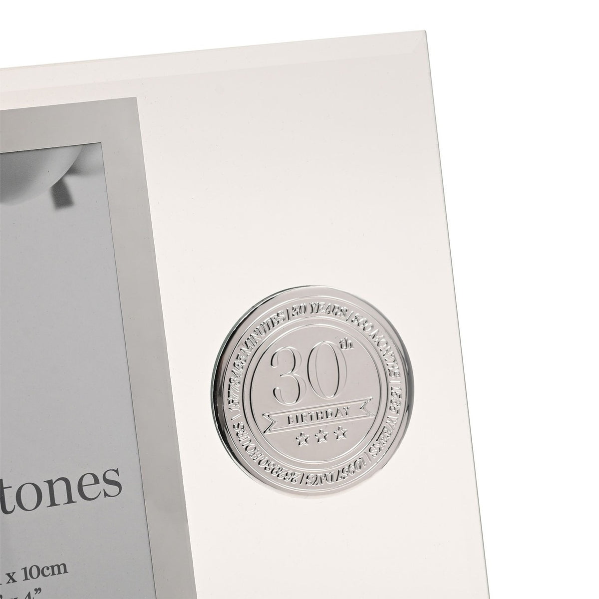 Close-up of a clear glass photo frame with mirrored silver border, featuring a round silver metal badge reading "30th Birthday" with stars, for a 6 x 4in photo.