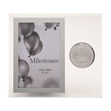 Clear glass photo frame for a 6x4in portrait with silver-grey border and "Milestones" sample image, featuring a round silver 50th birthday badge beside it.