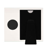 Clear glass photo frame for a 6 x 4in photo with a round silver 50th birthday badge, black velvet easel back stand, on a plain white background.
