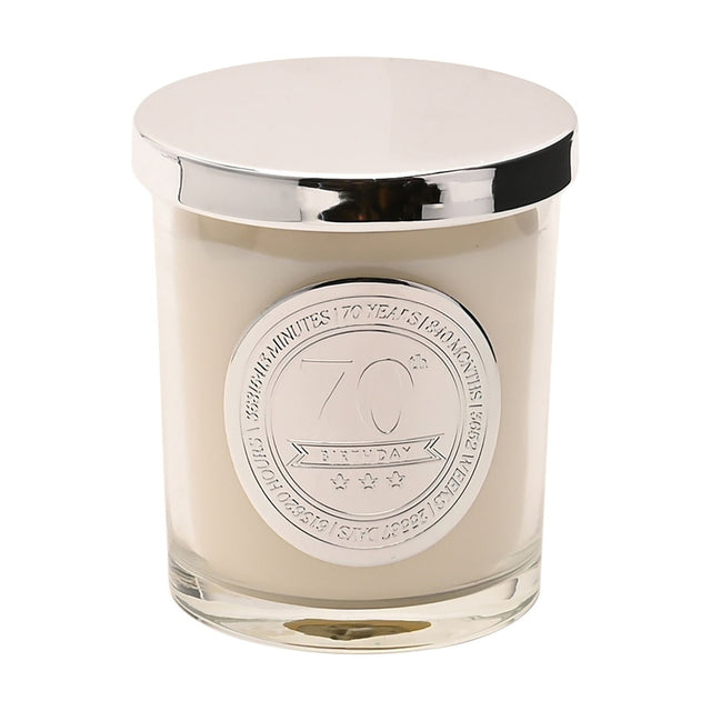 70th Birthday Sandalwood Scented Candle in a clear glass jar with white wax, silver lid, and round silver medallion reading "70th Birthday," on a plain white background.