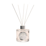 18th Birthday Sandalwood Reed Diffuser, round clear 200ml bottle with pale blush liquid, silver collar and white reeds, set on a plain white background.